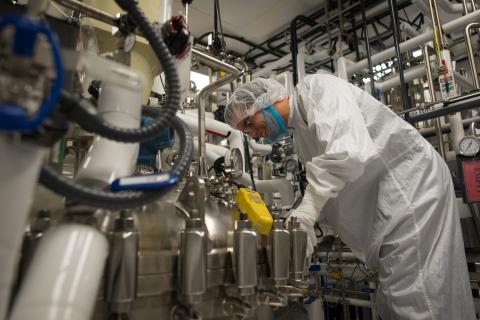 biomanufacturing worker on a production line