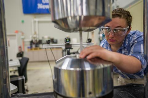 Marguerite Kennish UNH transfer scholar working with equipment