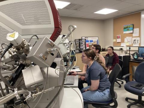 UNH Manchester students Trin Minard, Monique Gingras, & Jacob Brown using the Scanning Electron Microscope